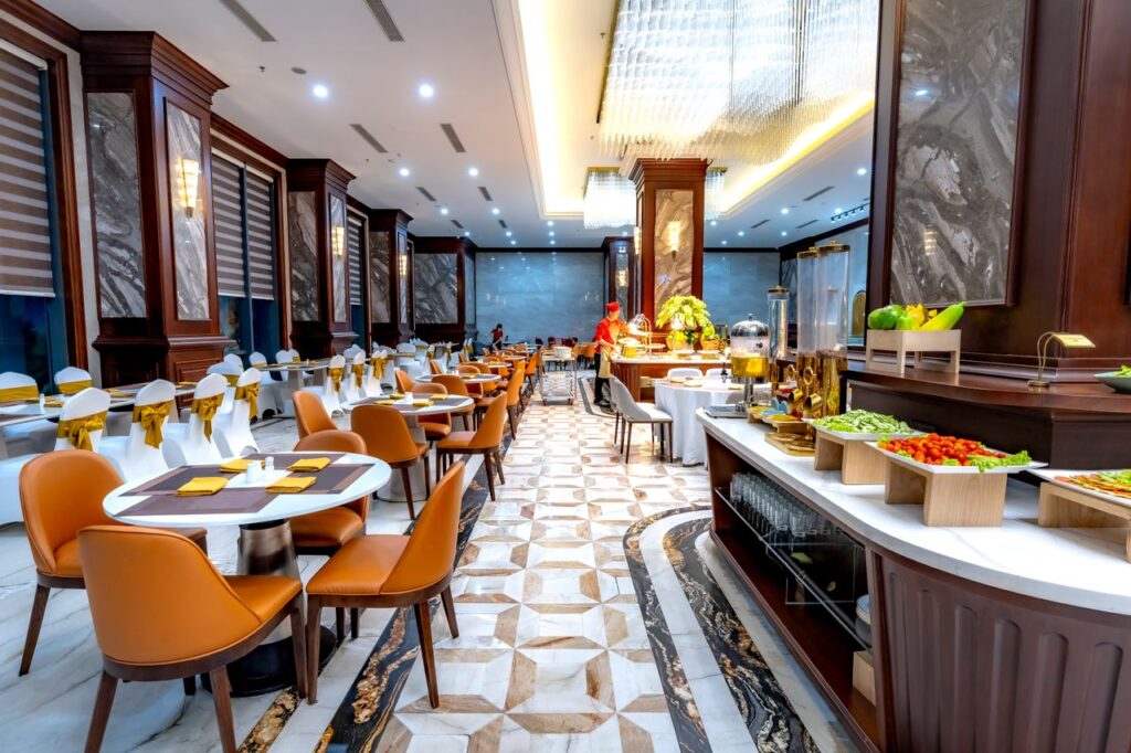 Elegant buffet restaurant interior with lavish decor and spacious seating arrangement.